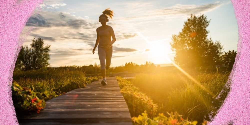 Woman running outdoors at sunrise for health and wellness