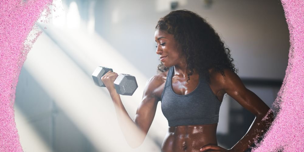 Woman lifting dumbbell for personal fitness and self-improvement