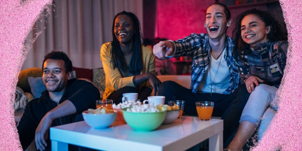 Friends watching TV together with popcorn enjoying entertainment